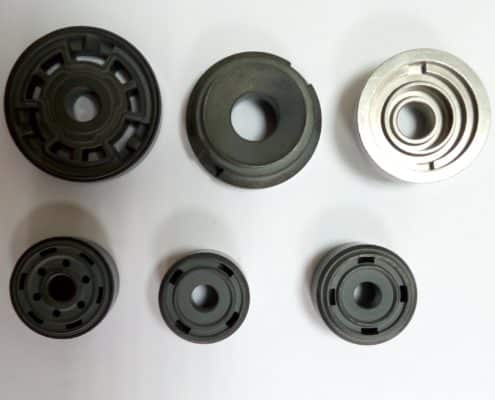 Sintered pistons for shock absorbers